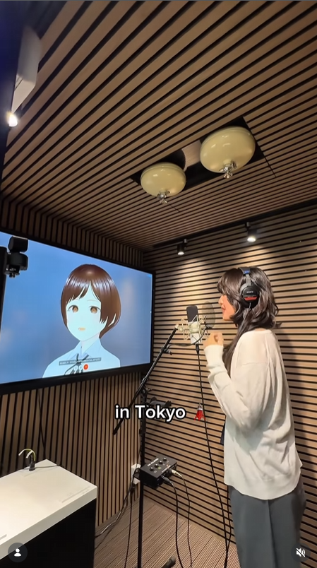 Inside the booth — lyrics screen, mic and warm wooden walls